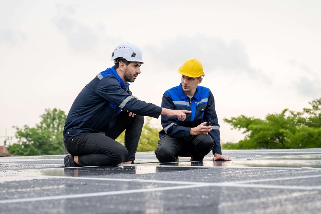 2 roofers on a roof conducting a professional safety inspection