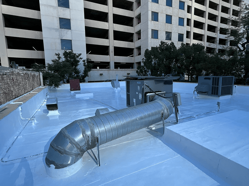 Metal ductwork installed on a flat rooftop of a building.