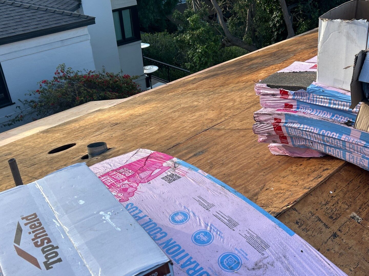 Stacks of Indian currency notes on a wooden table outside.