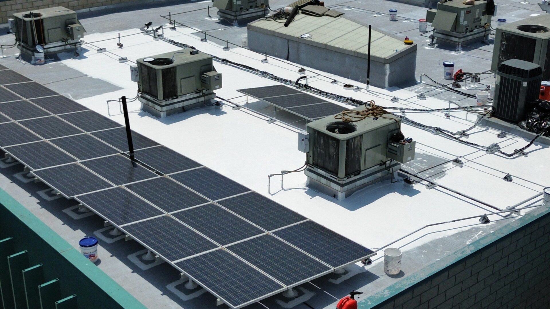 Solar panels and ventilation units on a rooftop.