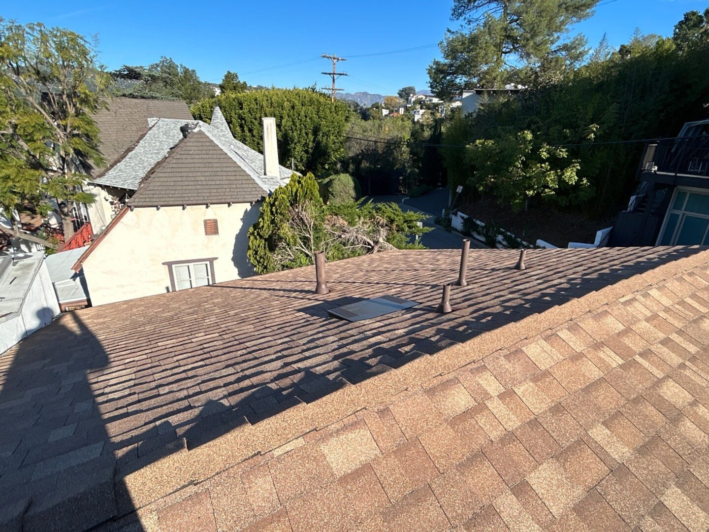 Rooftop with solar panel mounts on a sunny day.
