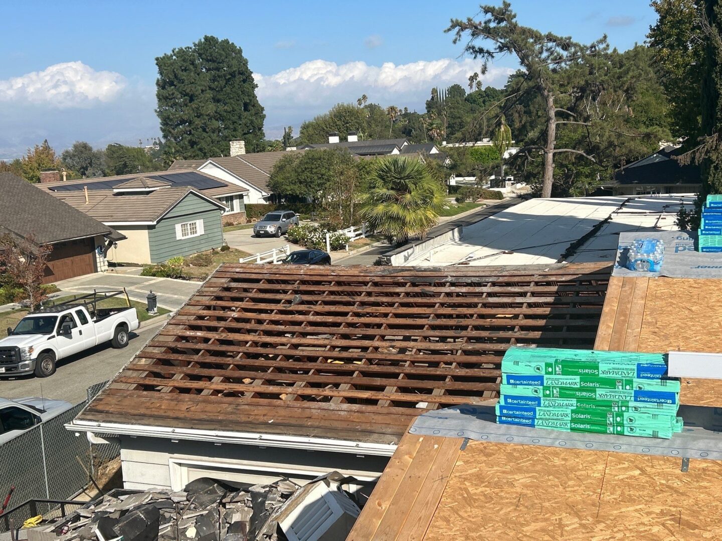Partial wooden roof frame under construction on a residential house.