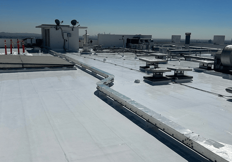 Flat commercial rooftop with HVAC units and ducts